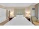 Elegant bedroom with neutral tones, a large bed, and stylish bedside tables at 135 E Harmon Ave # 221, Las Vegas, NV 89109