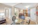 Bright dining area adjacent to a clean bathroom and modern kitchen at 135 E Harmon Ave # 221, Las Vegas, NV 89109