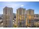 Luxury high-rise condos with gold-tinted windows offering city views and modern architectural design at 135 E Harmon Ave # 221, Las Vegas, NV 89109