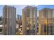 Condominium exterior showcasing the high-rise buildings with balconies and scenic city views at 135 E Harmon Ave # 221, Las Vegas, NV 89109