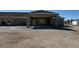 New construction property featuring an attached three car garage and covered entry at 1351 Huckleberry St, Pahrump, NV 89048