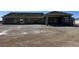 Sprawling new construction property featuring an attached three car garage and covered entry at 1351 Huckleberry St, Pahrump, NV 89048