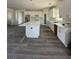 Modern kitchen featuring white cabinetry, marble countertops, and stainless steel appliances at 1351 Huckleberry St, Pahrump, NV 89048