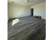 Living room featuring gray wood-look flooring and plenty of room to relax at 1351 Huckleberry St, Pahrump, NV 89048