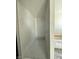 Step into this contemporary walk-in shower with marble-like tile at 1351 Huckleberry St, Pahrump, NV 89048