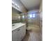 Bathroom with vanity, bathtub, and shower with gold trim at 1403 Santa Margarita St # D, Las Vegas, NV 89146