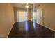 Bedroom with hardwood floors, ceiling fan, bright window, and access to the backyard at 1403 Santa Margarita St # D, Las Vegas, NV 89146