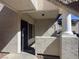 Covered entrance featuring a security door, textured walls, and a column detail at 1403 Santa Margarita St # D, Las Vegas, NV 89146