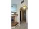 Hallway featuring tile floors, leading to a fireplace, doorway and other rooms at 1403 Santa Margarita St # D, Las Vegas, NV 89146