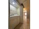 Laundry room with washer and dryer hookups, shelving, and tile flooring at 1403 Santa Margarita St # D, Las Vegas, NV 89146