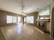 Inviting living room with tile flooring, ceiling fan, and mirrored fireplace at 1403 Santa Margarita St # D, Las Vegas, NV 89146