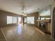 Inviting living room with tile flooring, ceiling fan, and mirrored fireplace at 1403 Santa Margarita St # D, Las Vegas, NV 89146
