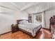 Comfortable bedroom featuring hardwood floors, a queen-sized bed, and a window with natural light at 147 Cervantes St, Las Vegas, NV 89101