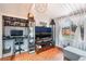 Comfortable living room with hardwood floors, a desk, and large display case at 147 Cervantes St, Las Vegas, NV 89101