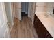 Bathroom featuring tiled floors, double sink vanity, and a glass shower, offering modern convenience at 150 N Las Vegas Blvd # 1217, Las Vegas, NV 89101