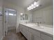Modern bathroom features double sinks, a large vanity, and access to the shower and toilet at 150 Short Ruff Way, Las Vegas, NV 89148