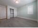 Light and airy bedroom with a closet with sliding doors, base trim, and a light-colored wood-look floor at 150 Short Ruff Way, Las Vegas, NV 89148