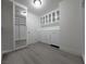 Large closet with built-in cabinetry, mirrors, and drawers for maximum storage solutions at 150 Short Ruff Way, Las Vegas, NV 89148