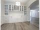 Dining room featuring built-in cabinets and hardwood floors, perfect for entertaining at 150 Short Ruff Way, Las Vegas, NV 89148