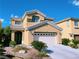 Attractive two-story home with landscaped front yard, two-car garage, and neutral exterior at 150 Short Ruff Way, Las Vegas, NV 89148