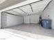 Spacious two-car garage with installed shelving and extra storage cabinets at 150 Short Ruff Way, Las Vegas, NV 89148