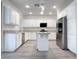 Modern kitchen with stainless steel appliances, granite countertops, and a center island at 150 Short Ruff Way, Las Vegas, NV 89148