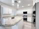 Bright kitchen with granite countertops, stainless steel appliances, and a center island at 150 Short Ruff Way, Las Vegas, NV 89148