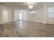 Bright living room with hardwood floors, arched doorway and lots of natural light at 150 Short Ruff Way, Las Vegas, NV 89148