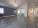 Living room features new floor, chandelier, blue accent wall, and an open floor plan at 150 Short Ruff Way, Las Vegas, NV 89148