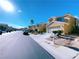 Beautiful view of a friendly neighborhood with desert landscaping and clear, blue skies at 150 Short Ruff Way, Las Vegas, NV 89148