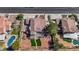 Aerial view of a home showcasing a backyard with artificial turf, desert landscaping, patio, and a private pool at 1598 Bermuda Dunes Dr, Boulder City, NV 89005