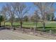 Beautiful backyard view with lush green golf course visible beyond decorative fence and patio at 1598 Bermuda Dunes Dr, Boulder City, NV 89005
