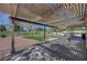 Great back yard with artificial turf, covered patio, and view of green space at 1598 Bermuda Dunes Dr, Boulder City, NV 89005