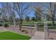 Beautifully landscaped backyard with artificial turf, desert plants, and a golf course view at 1598 Bermuda Dunes Dr, Boulder City, NV 89005