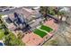 Aerial view of landscaped backyard featuring covered patio and well-maintained yard with artificial grass at 1598 Bermuda Dunes Dr, Boulder City, NV 89005