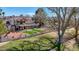 Spacious backyard featuring a covered patio, artificial turf, and well-maintained landscaping for outdoor enjoyment at 1598 Bermuda Dunes Dr, Boulder City, NV 89005