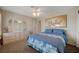 Comfortable bedroom featuring carpet, ceiling fan, and closet with a matching dresser at 1598 Bermuda Dunes Dr, Boulder City, NV 89005