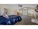 Spacious main bedroom with a ceiling fan, fireplace, and access to the outdoor living space at 1598 Bermuda Dunes Dr, Boulder City, NV 89005