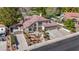 Stately home with red tile roof, three-car garage, and meticulously landscaped front yard at 1598 Bermuda Dunes Dr, Boulder City, NV 89005