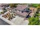 Stunning home with a 3-car garage, lush landscaping, and tile roof, offering luxury and curb appeal at 1598 Bermuda Dunes Dr, Boulder City, NV 89005