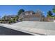 Exterior shot of the two-story home showing the three car garage at 1598 Bermuda Dunes Dr, Boulder City, NV 89005
