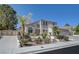 Exterior shot of the two-story home showing the front landscaping at 1598 Bermuda Dunes Dr, Boulder City, NV 89005