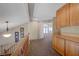 Hallway with wood banister and built-in cabinets leading into the living area at 1598 Bermuda Dunes Dr, Boulder City, NV 89005