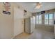 Eat in kitchen with white cabinets, view to the back yard, and vintage decor at 1598 Bermuda Dunes Dr, Boulder City, NV 89005