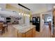 Open kitchen with granite island bar top and pendant lighting connecting to the Gathering room at 1598 Bermuda Dunes Dr, Boulder City, NV 89005