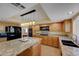 Spacious kitchen with granite countertops, stainless steel appliances, and custom cabinetry at 1598 Bermuda Dunes Dr, Boulder City, NV 89005
