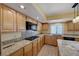 This updated kitchen boasts granite countertops, gas range, and ample cabinet space at 1598 Bermuda Dunes Dr, Boulder City, NV 89005