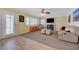 Cozy living area with fireplace, ceiling fan, and outdoor access at 1598 Bermuda Dunes Dr, Boulder City, NV 89005