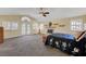 Main bedroom with high ceilings, fireplace, ceiling fan, and outdoor access at 1598 Bermuda Dunes Dr, Boulder City, NV 89005