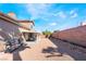 This backyard has a covered patio, rock ground cover, and a BBQ grill at 1893 Donnington Ct, Las Vegas, NV 89123